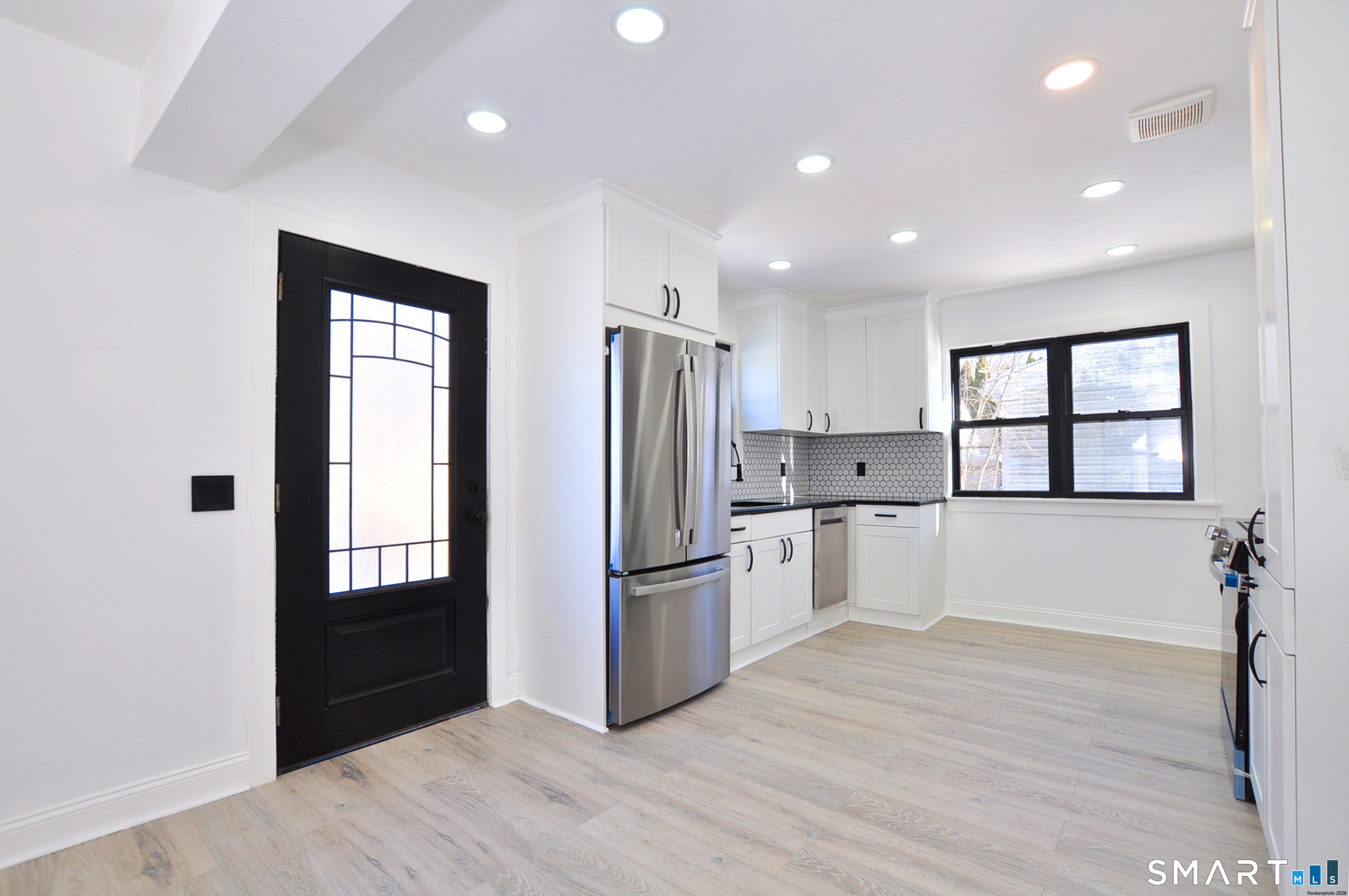 443 Todd Road Wolcott, CT 06716 - Photo 3 of 41 a kitchen with a refrigerator and a sink