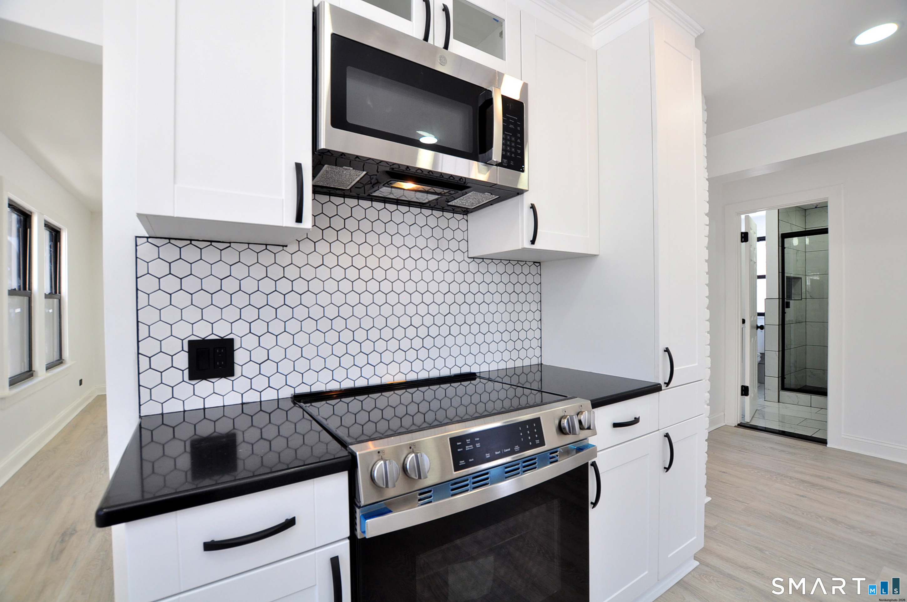 443 Todd Road Wolcott, CT 06716 - Photo 33 of 41 a kitchen with a stove and a microwave