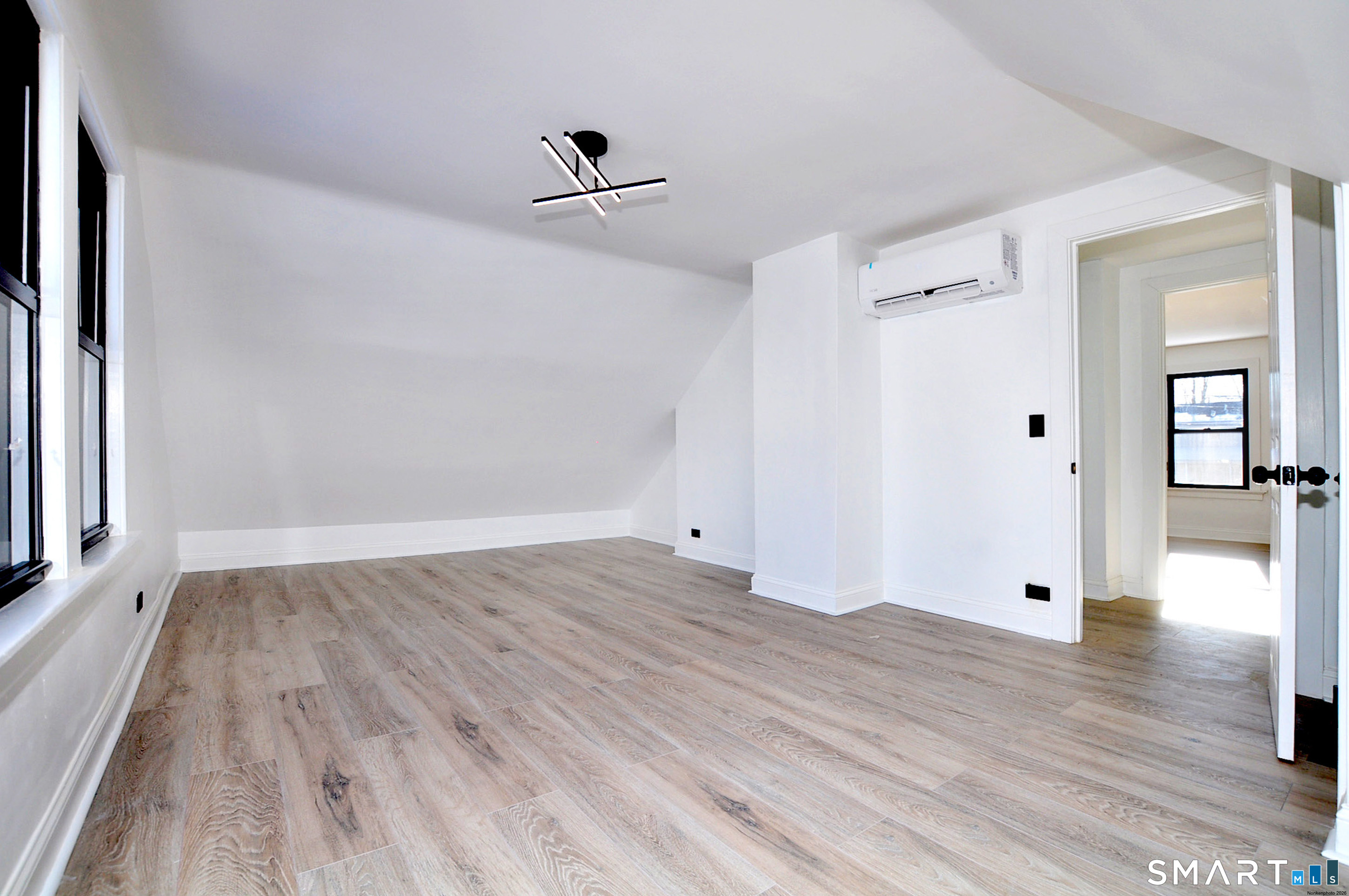 443 Todd Road Wolcott, CT 06716 - Photo 35 of 41 wooden floor in an empty room with a window