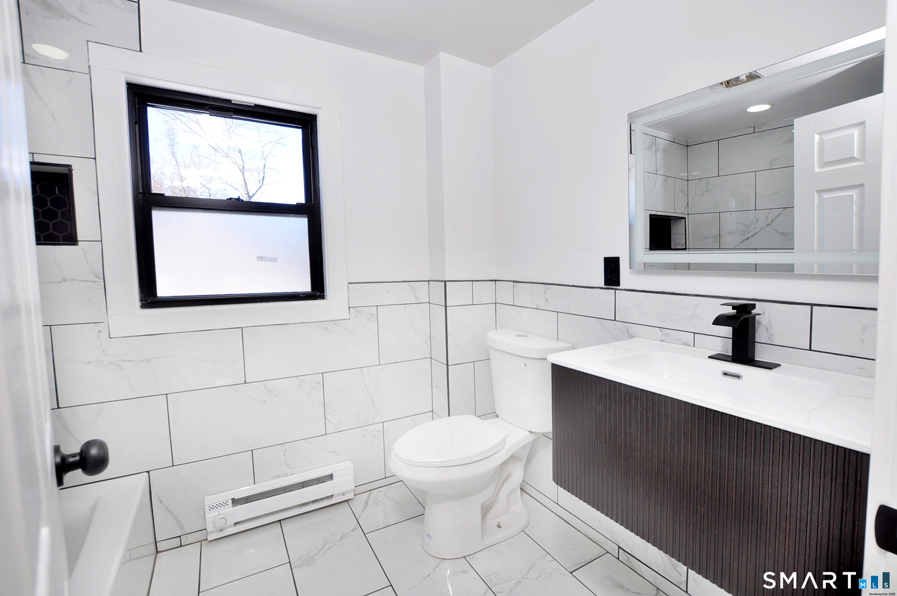 443 Todd Road Wolcott, CT 06716 - Photo 7 of 41 a bathroom with a toilet sink and mirror