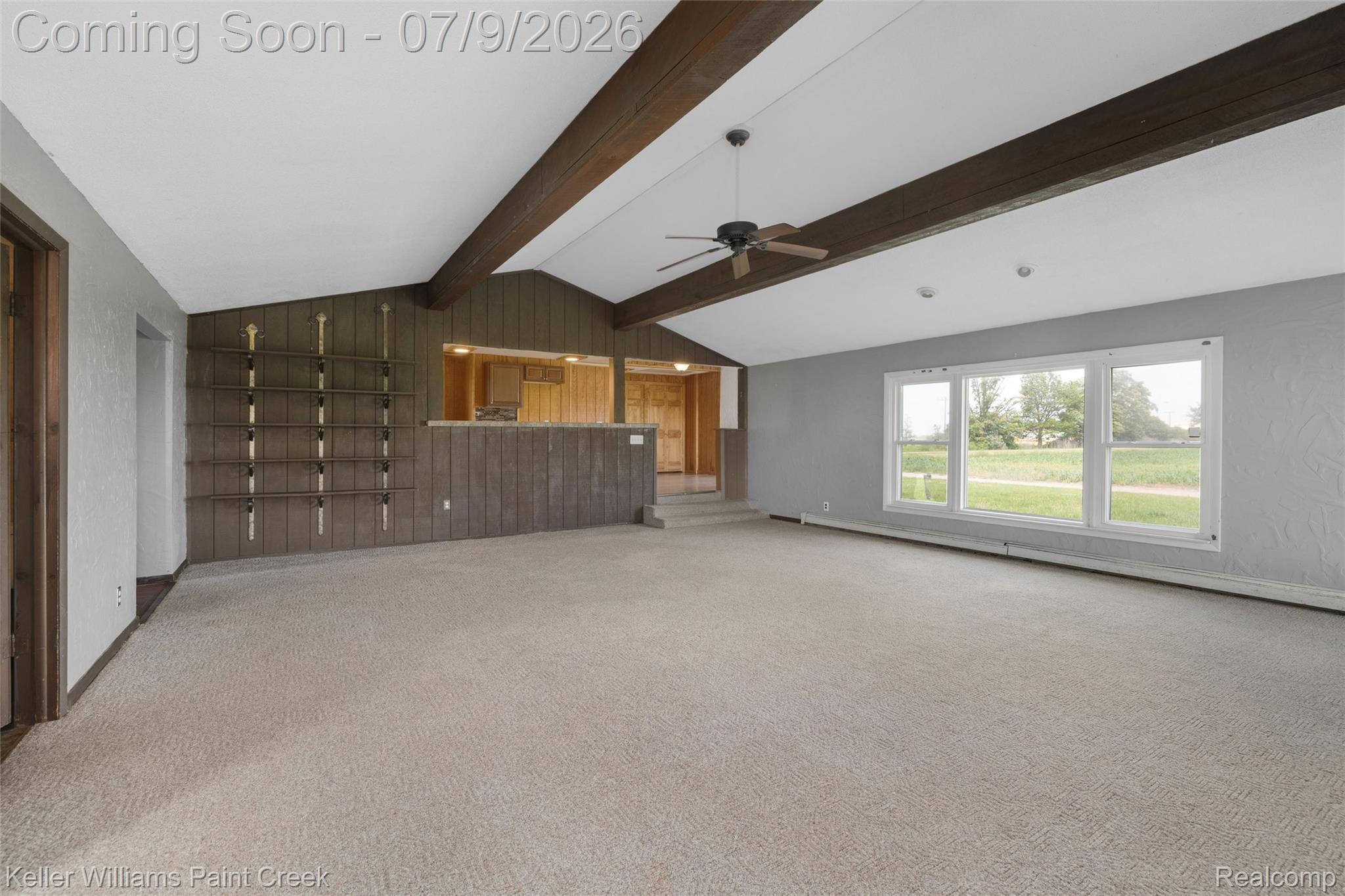 28780 School Section Road Richmond, MI 48062 - Photo 23 of 50 Spacious carpeted room featuring vaulted ceilings with exposed wood beams, a ceiling fan, and built-in shelving