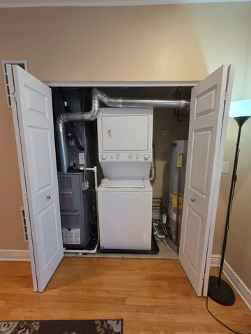 a utility room with closet dryer and washer