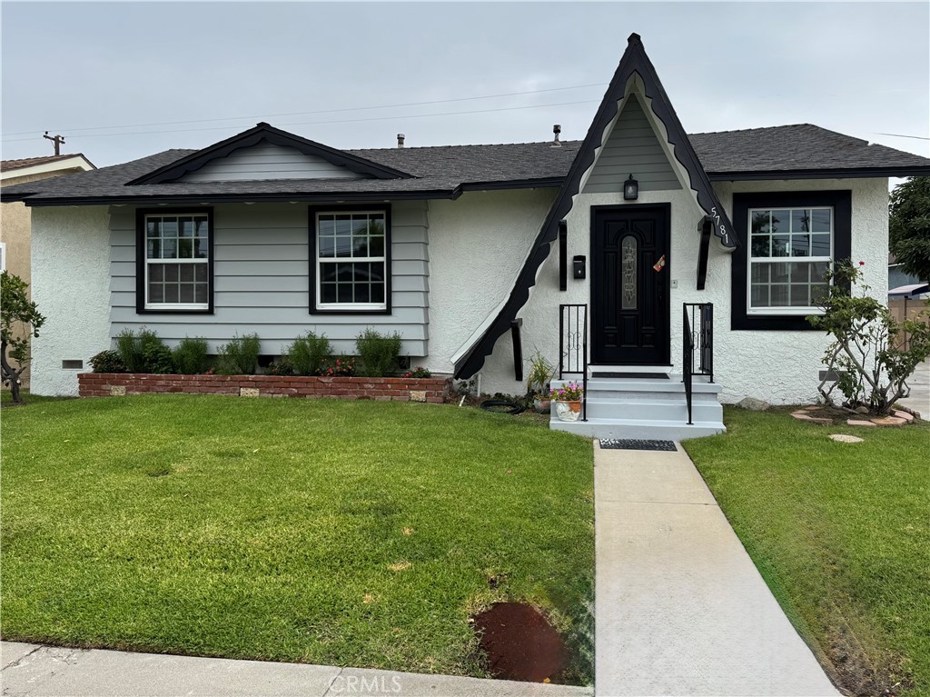 5781 Lime Avenue Cypress, CA 90630 - Photo 1 of 40 a front view of a house with a yard