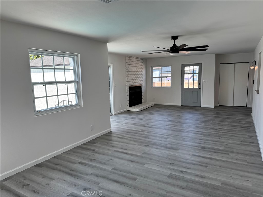 5781 Lime Avenue Cypress, CA 90630 - Photo 17 of 40 a view of an empty room with wooden floor and a window