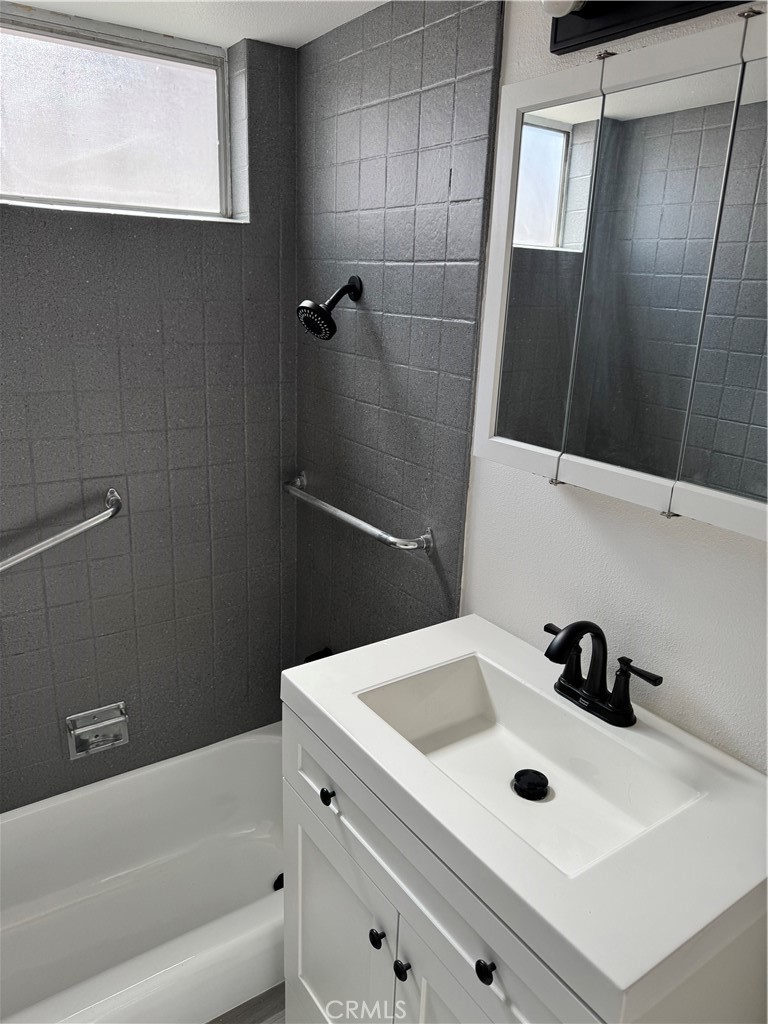5781 Lime Avenue Cypress, CA 90630 - Photo 29 of 40 a bathroom with a sink and a tub