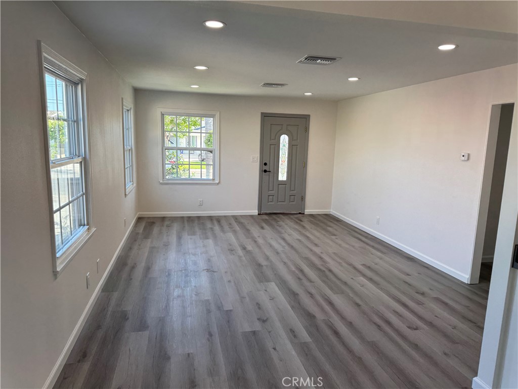 5781 Lime Avenue Cypress, CA 90630 - Photo 6 of 40 wooden floor in an empty room with a window