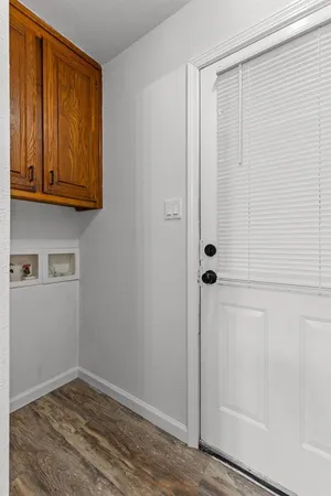 a view of an entryway with wooden floor