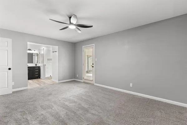 a bathroom with a double vanity sink mirror and shower