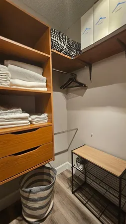 a living room with furniture and a dining table with kitchen view