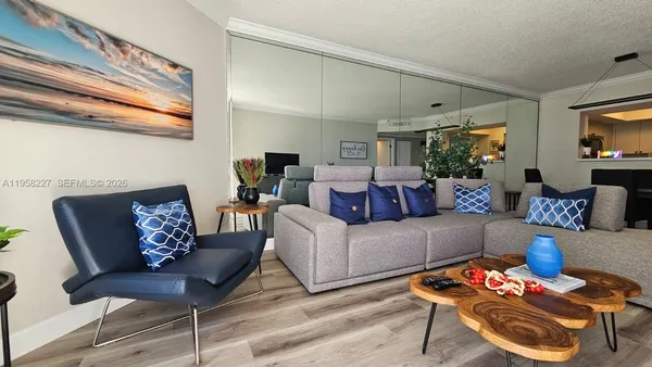 a view of kitchen with furniture and wooden floor