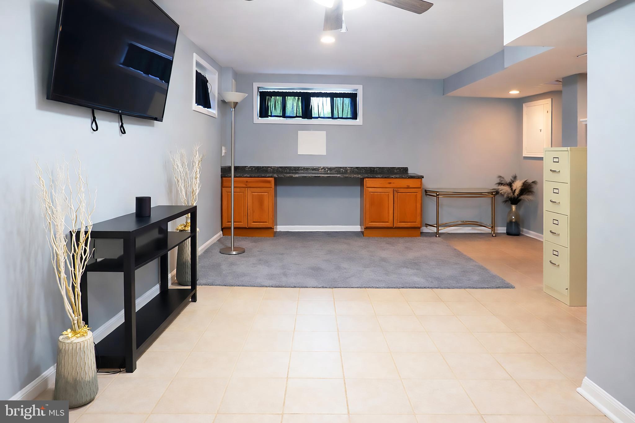 3935 Clay Place Northeast Washington, DC 20019 - Photo 15 of 17 a view of living room filled with furniture and a flat screen tv