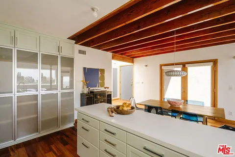 a room with a large window and storage