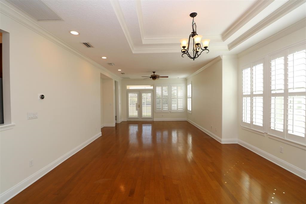 207 Sunset Point St. Augustine, FL 32080 - Photo 18 of 59 a view of an empty room with wooden floor and a window