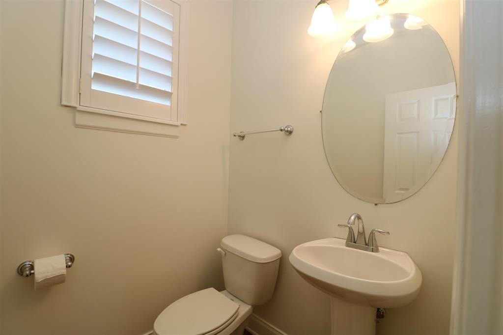 207 Sunset Point St. Augustine, FL 32080 - Photo 25 of 59 a bathroom with a toilet sink and mirror
