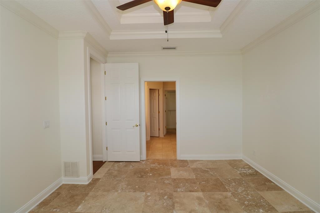 207 Sunset Point St. Augustine, FL 32080 - Photo 37 of 59 a view of an empty room and chandelier fan