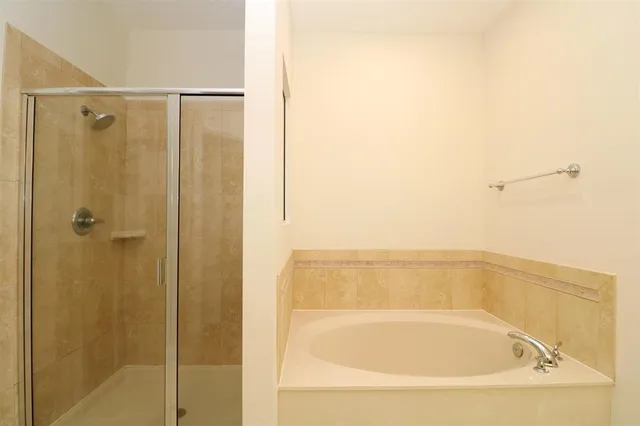 an empty room with a bathroom