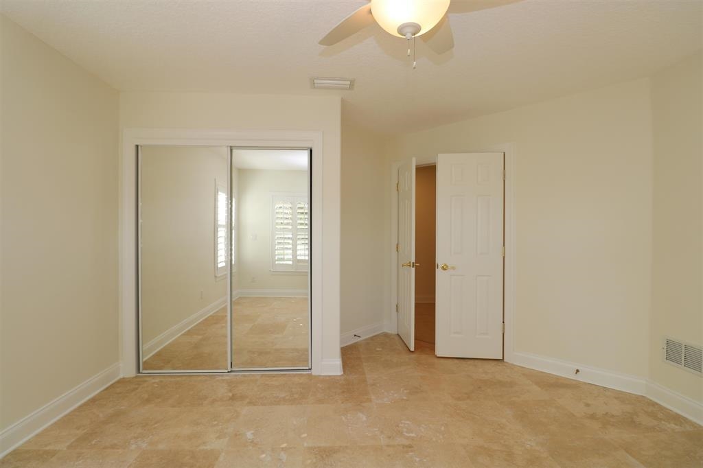 207 Sunset Point St. Augustine, FL 32080 - Photo 45 of 59 an empty room with sliding door