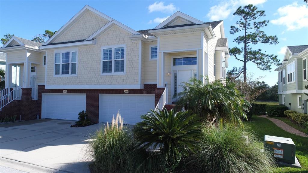 207 Sunset Point St. Augustine, FL 32080 - Photo 5 of 59 a front view of a house with a yard