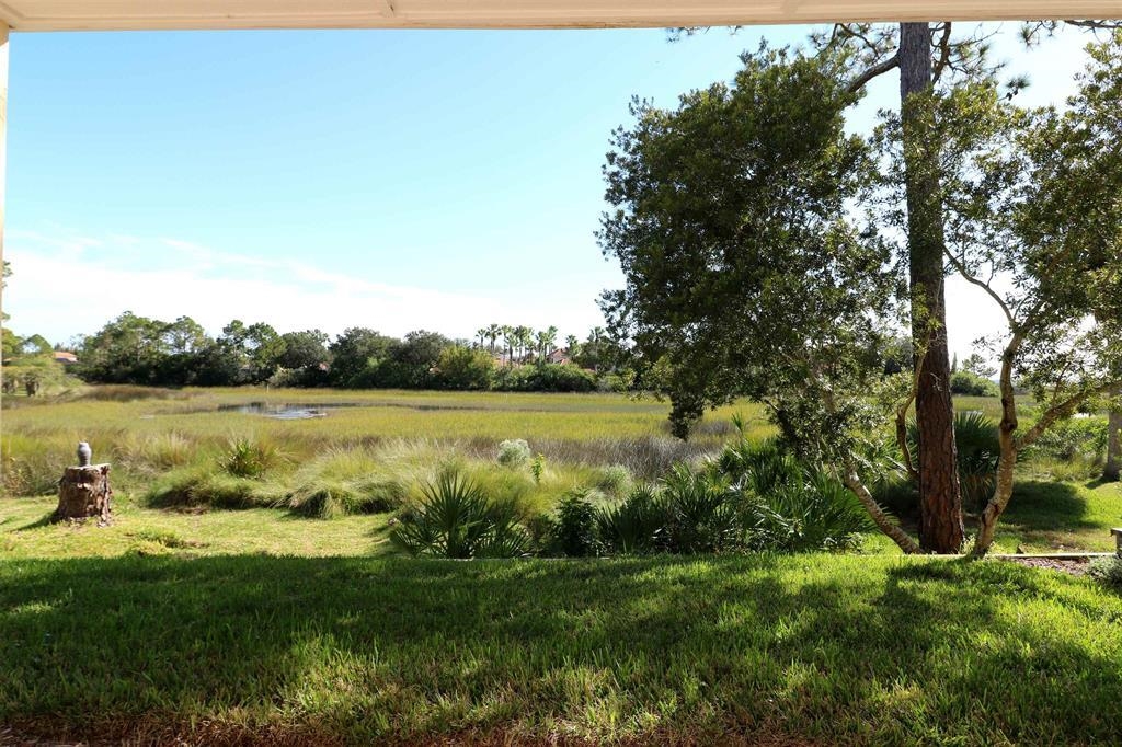 207 Sunset Point St. Augustine, FL 32080 - Photo 7 of 59 a view of a lake from a yard