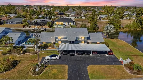 a view of a swimming pool with seating area