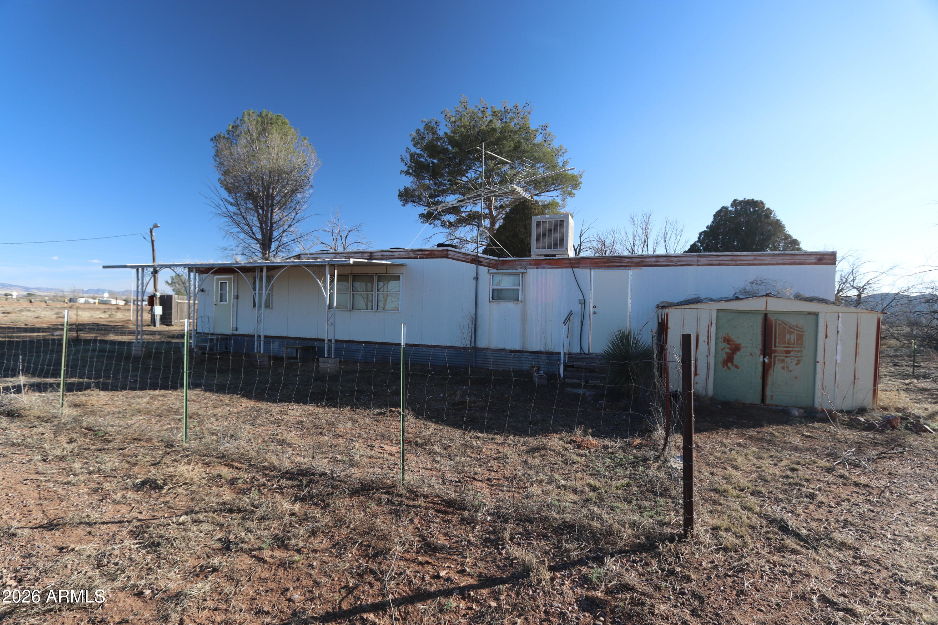6286 East Mockingbird Road, Unit 8 Pearce, AZ 85625 - Photo 14 of 28 a backyard of a house