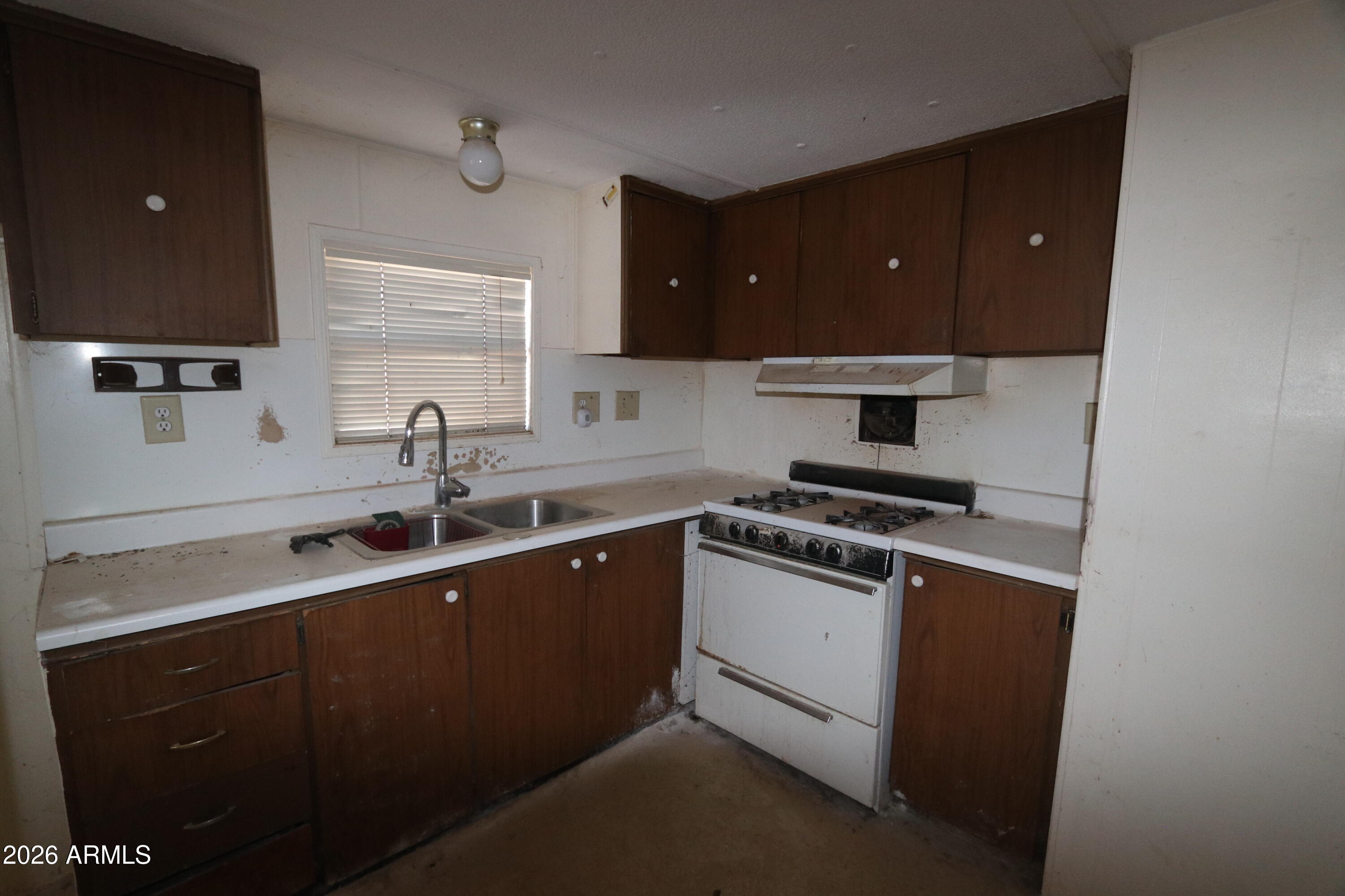 6286 East Mockingbird Road, Unit 8 Pearce, AZ 85625 - Photo 16 of 28 a kitchen with a sink and cabinets