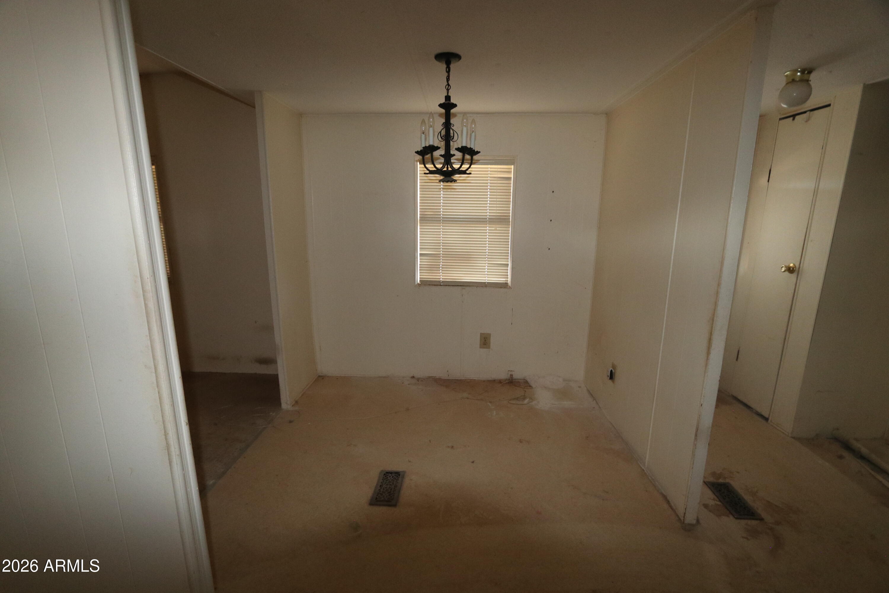 6286 East Mockingbird Road, Unit 8 Pearce, AZ 85625 - Photo 17 of 28 a view of a hallway with a window