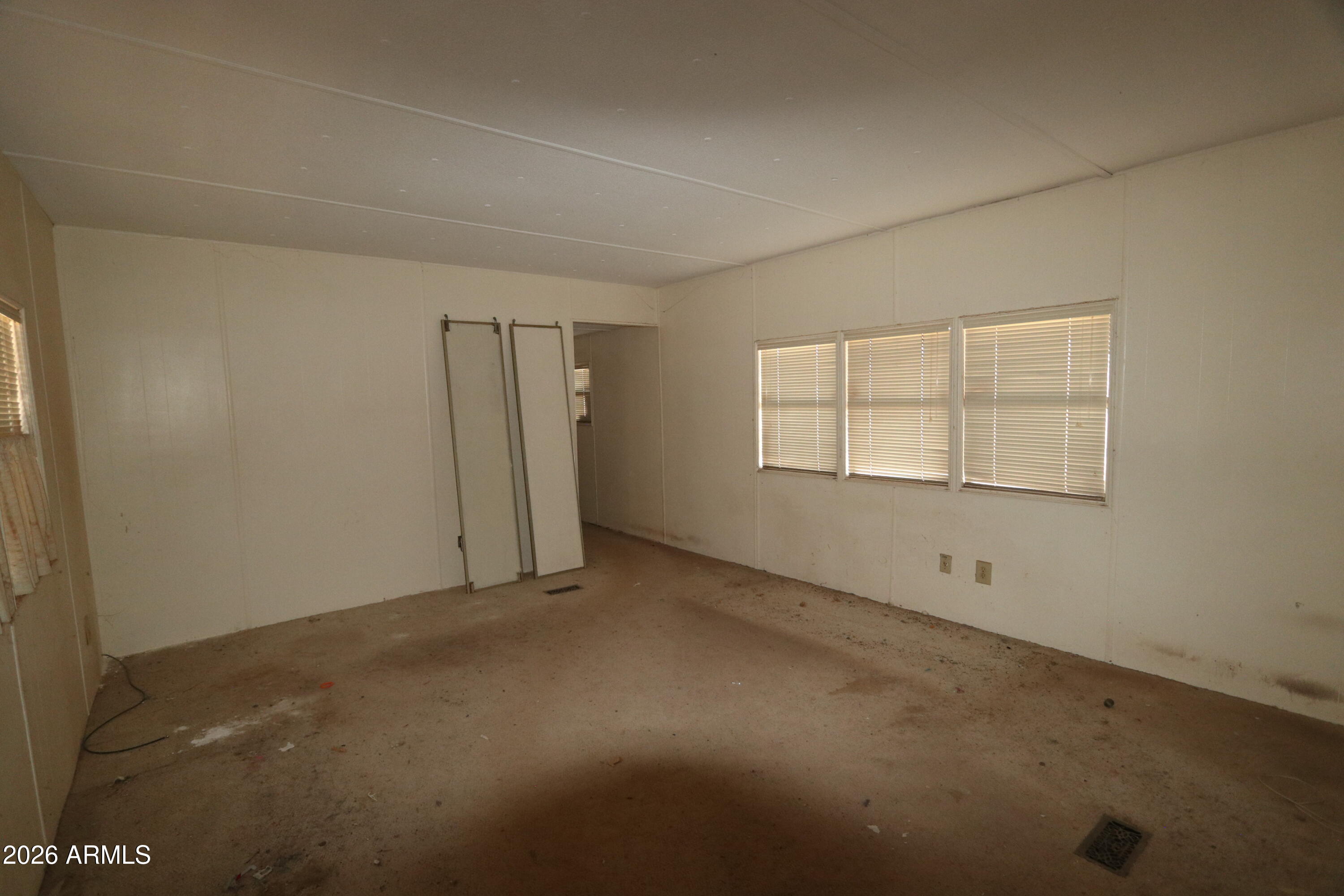 6286 East Mockingbird Road, Unit 8 Pearce, AZ 85625 - Photo 18 of 28 an empty room with windows