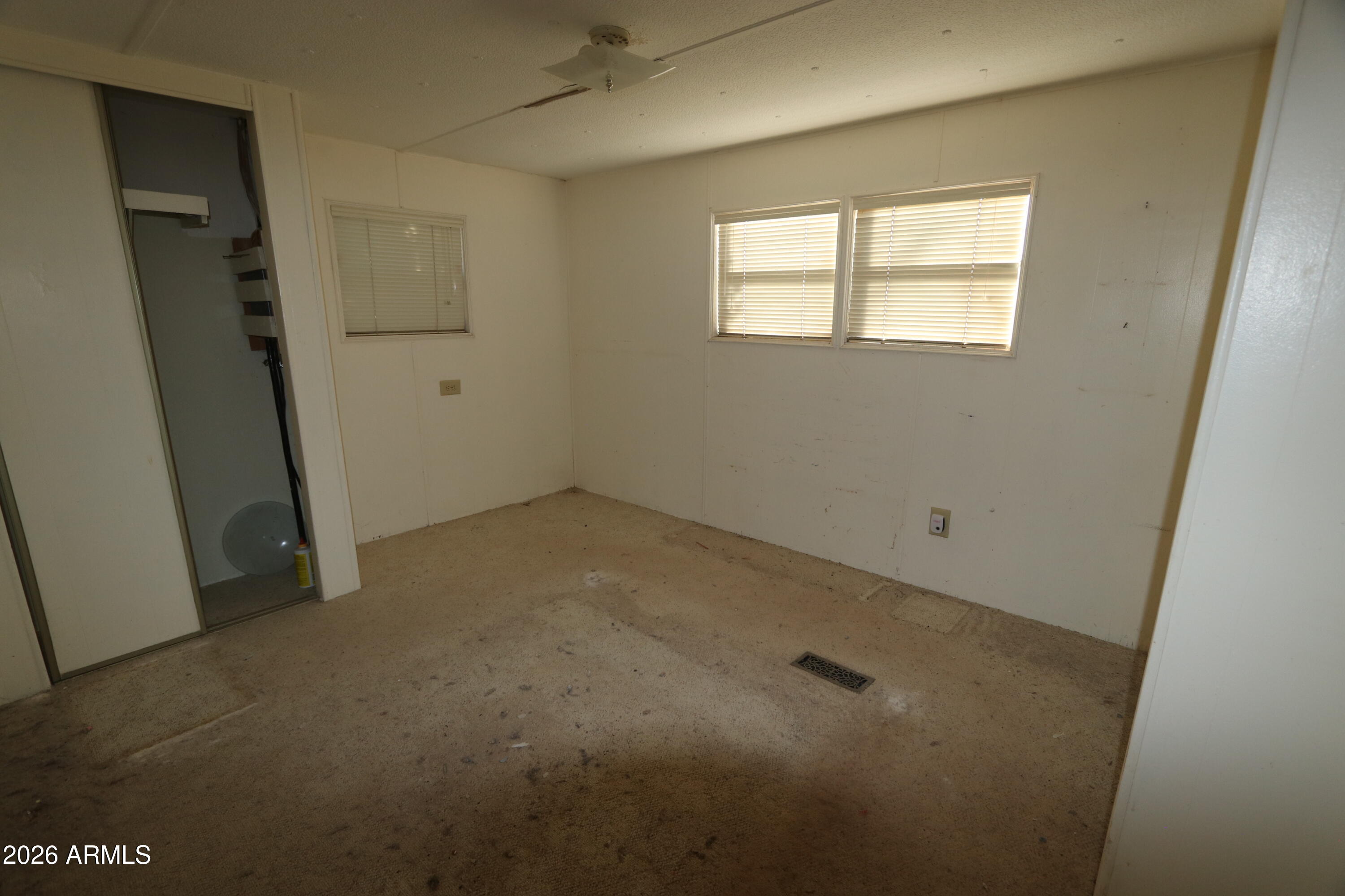 6286 East Mockingbird Road, Unit 8 Pearce, AZ 85625 - Photo 20 of 28 an empty room with windows