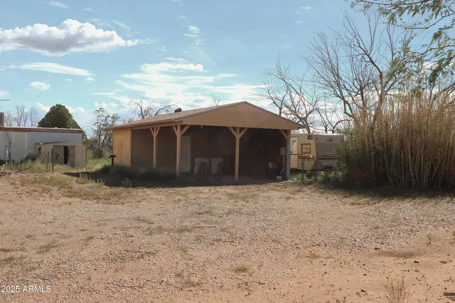a house view with a backyard space