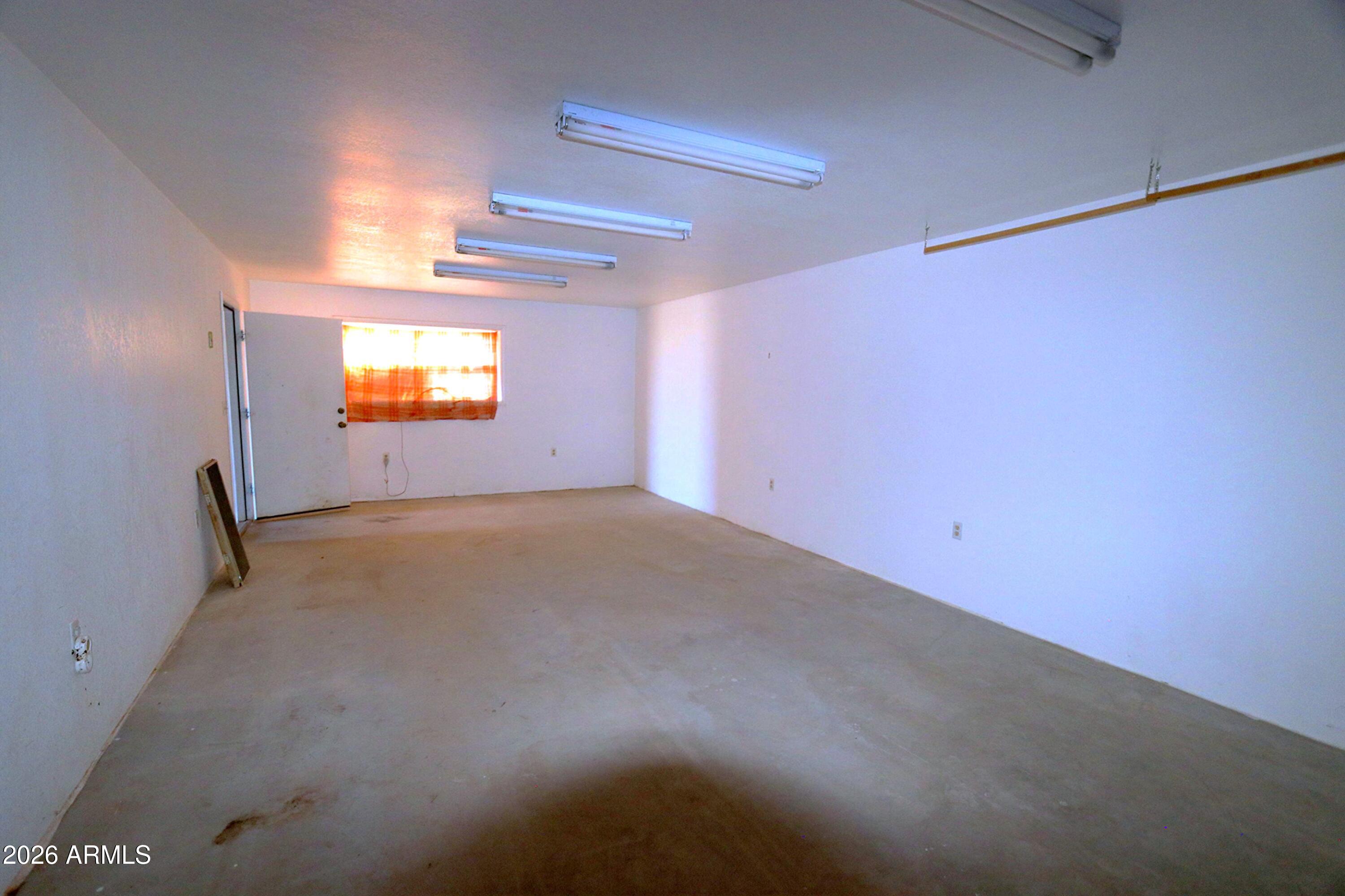 6286 East Mockingbird Road, Unit 8 Pearce, AZ 85625 - Photo 6 of 28 an empty room with windows