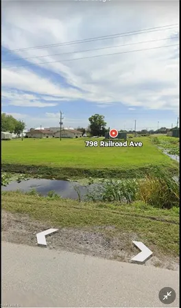 a view of a golf course with a building