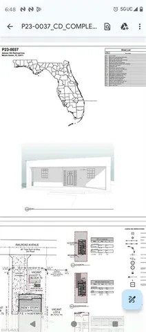 a view of a lake with houses in the back