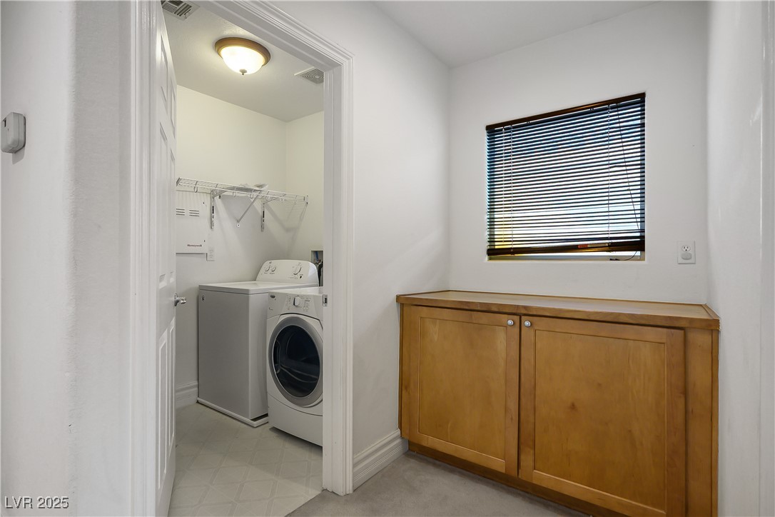6632 Babys Tear Place Las Vegas, NV 89148 - Photo 6 of 27 Laundry area with washer and clothes dryer