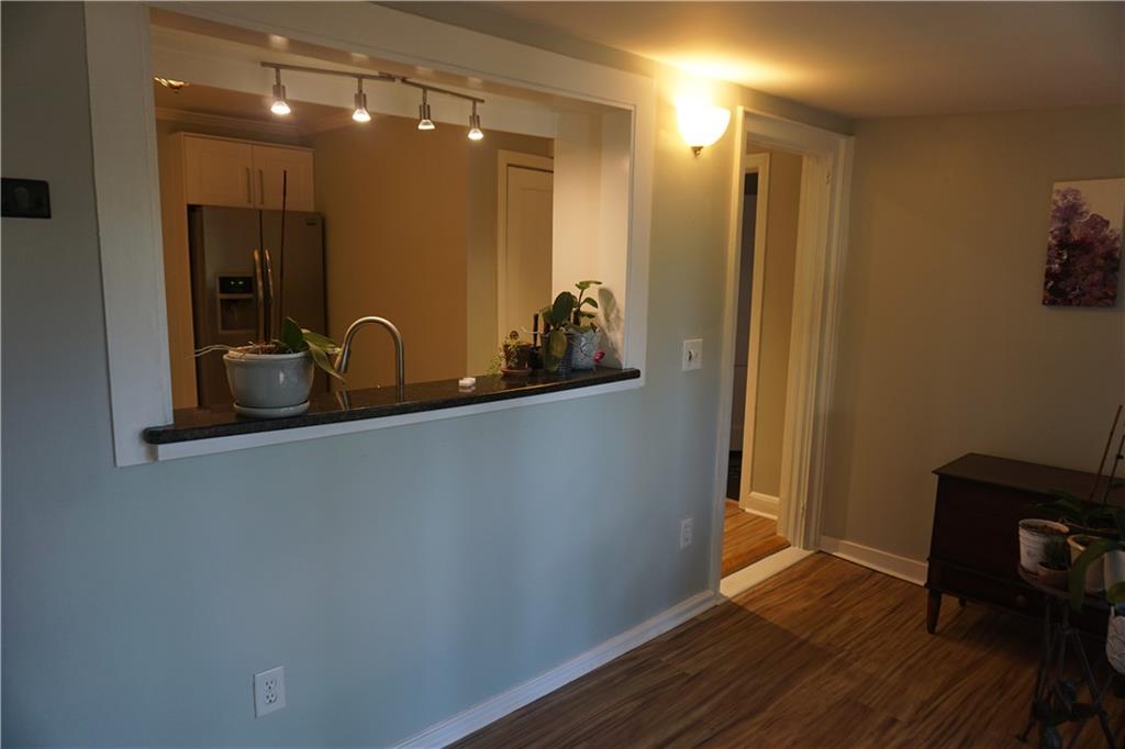 2210 Lenox Road Northeast Atlanta, GA 30324 - Photo 11 of 22 a bathroom with a sink mirror and vanity