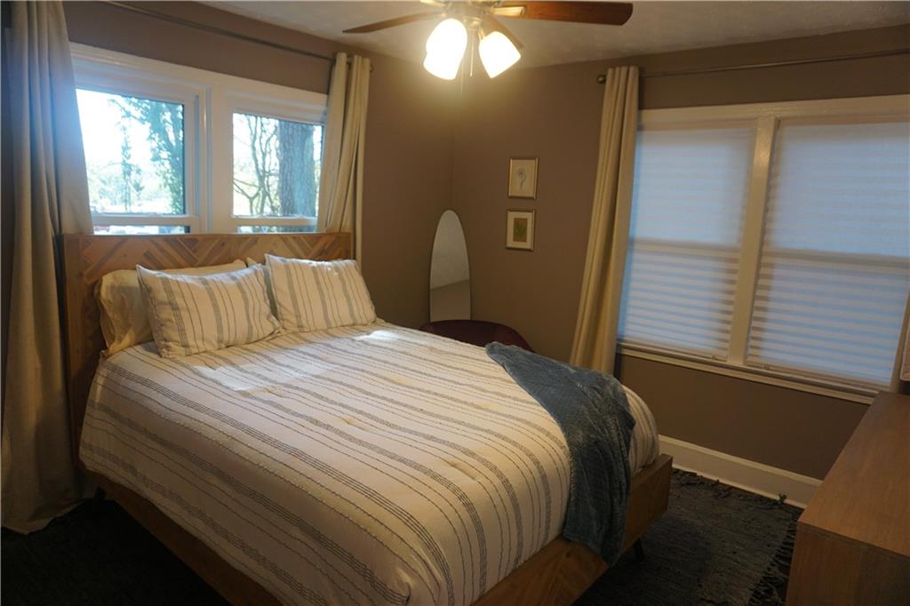 2210 Lenox Road Northeast Atlanta, GA 30324 - Photo 12 of 22 a bedroom with a bed and a window