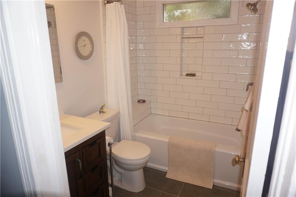 2210 Lenox Road Northeast Atlanta, GA 30324 - Photo 15 of 22 a bathroom with a toilet and shower