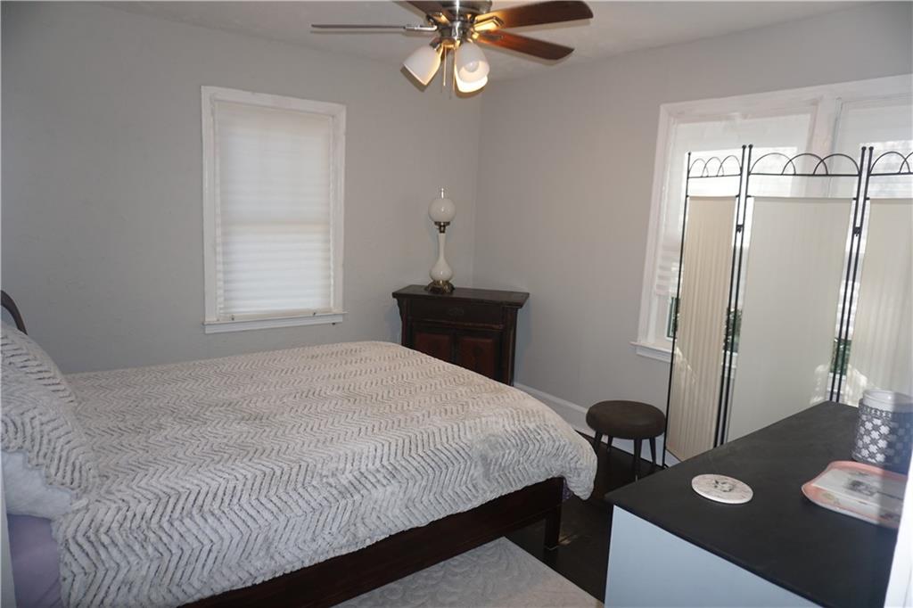 2210 Lenox Road Northeast Atlanta, GA 30324 - Photo 17 of 22 a bedroom with a bed and a window