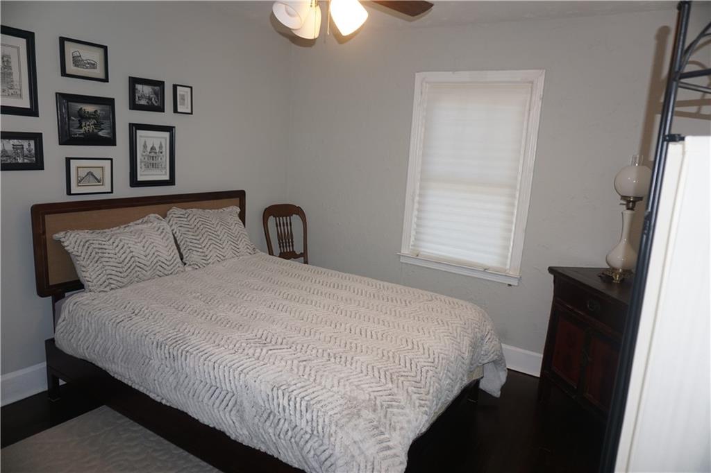 2210 Lenox Road Northeast Atlanta, GA 30324 - Photo 18 of 22 a bedroom with a bed and a window