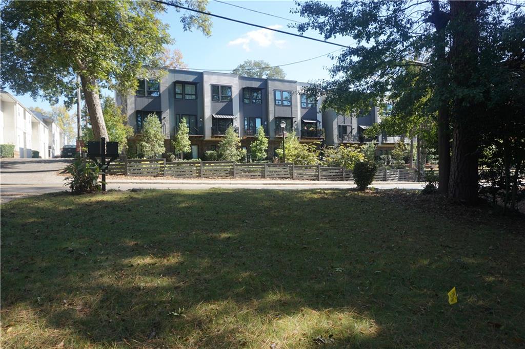 2210 Lenox Road Northeast Atlanta, GA 30324 - Photo 22 of 22 a front view of a house with a yard