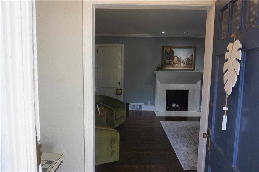 2210 Lenox Road Northeast Atlanta, GA 30324 - Photo 3 of 22 a living room with furniture and a fireplace