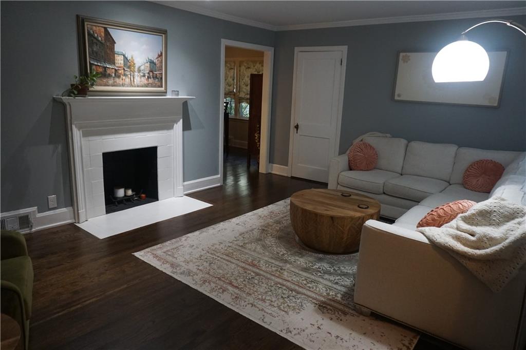 2210 Lenox Road Northeast Atlanta, GA 30324 - Photo 4 of 22 a living room with furniture and a fireplace
