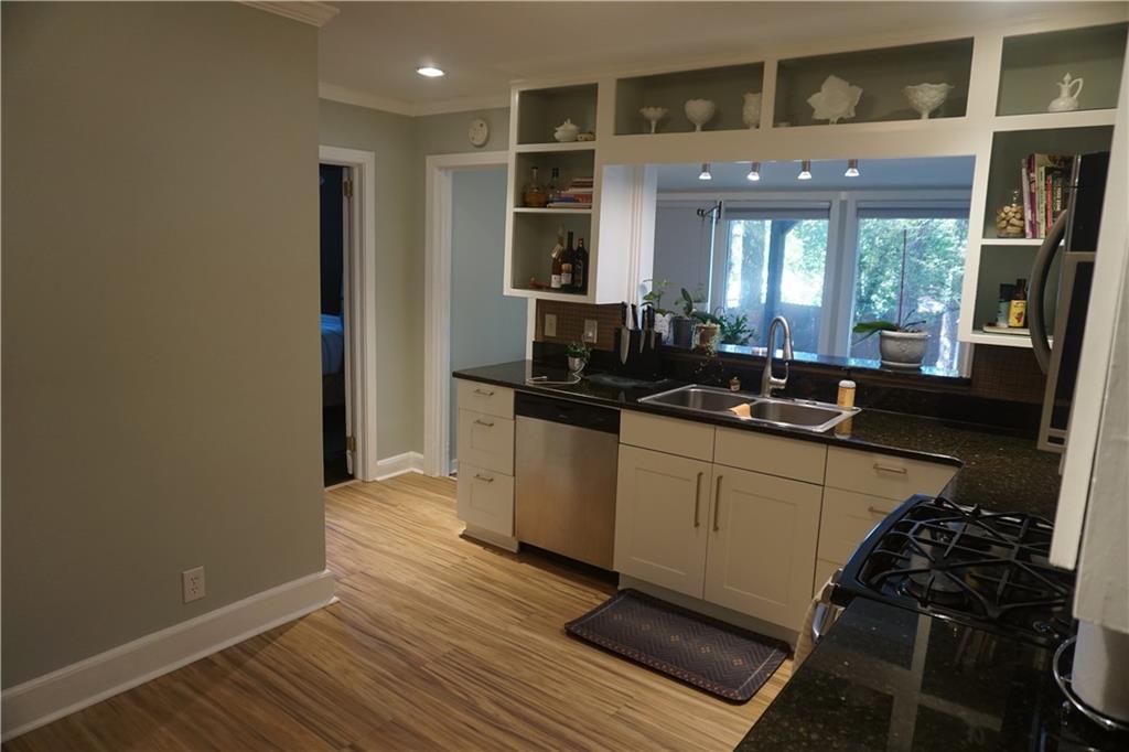 2210 Lenox Road Northeast Atlanta, GA 30324 - Photo 7 of 22 a kitchen with sink and refrigerator