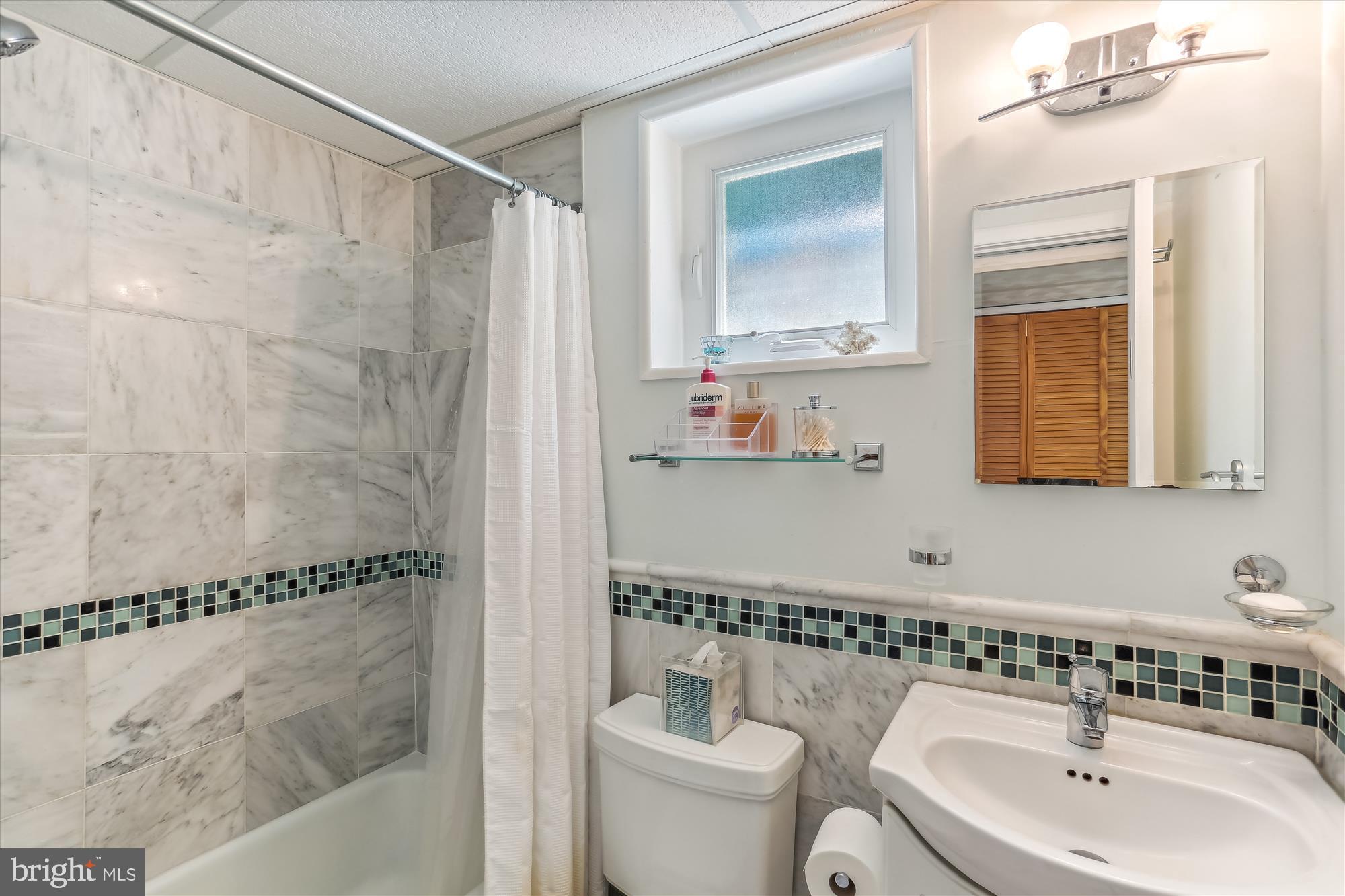 4010 Delancy Drive Silver Spring, MD 20906 - Photo 37 of 63 Bath with natural marble tiling