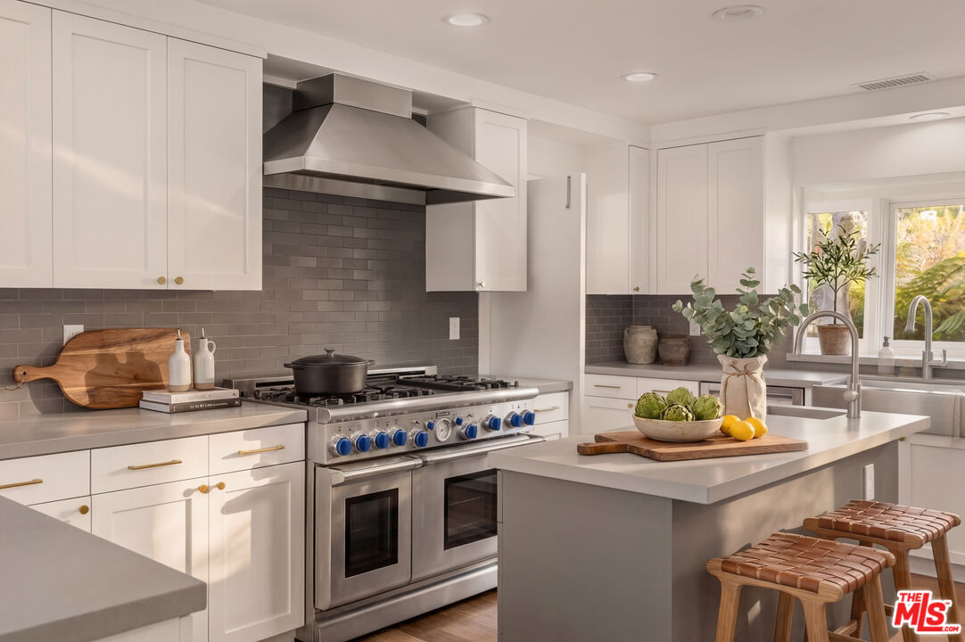 576 East Channel Road Santa Monica, CA 90402 - Photo 11 of 22 a kitchen with a stove and a white cabinets