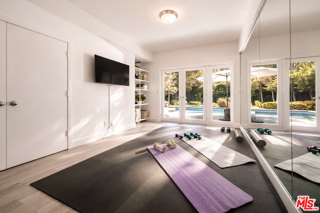 576 East Channel Road Santa Monica, CA 90402 - Photo 13 of 22 a living room with furniture and a flat screen tv