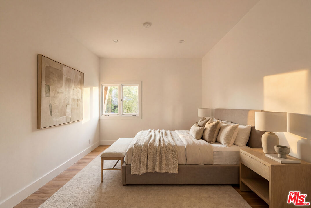 576 East Channel Road Santa Monica, CA 90402 - Photo 16 of 22 a bedroom with a bed and window