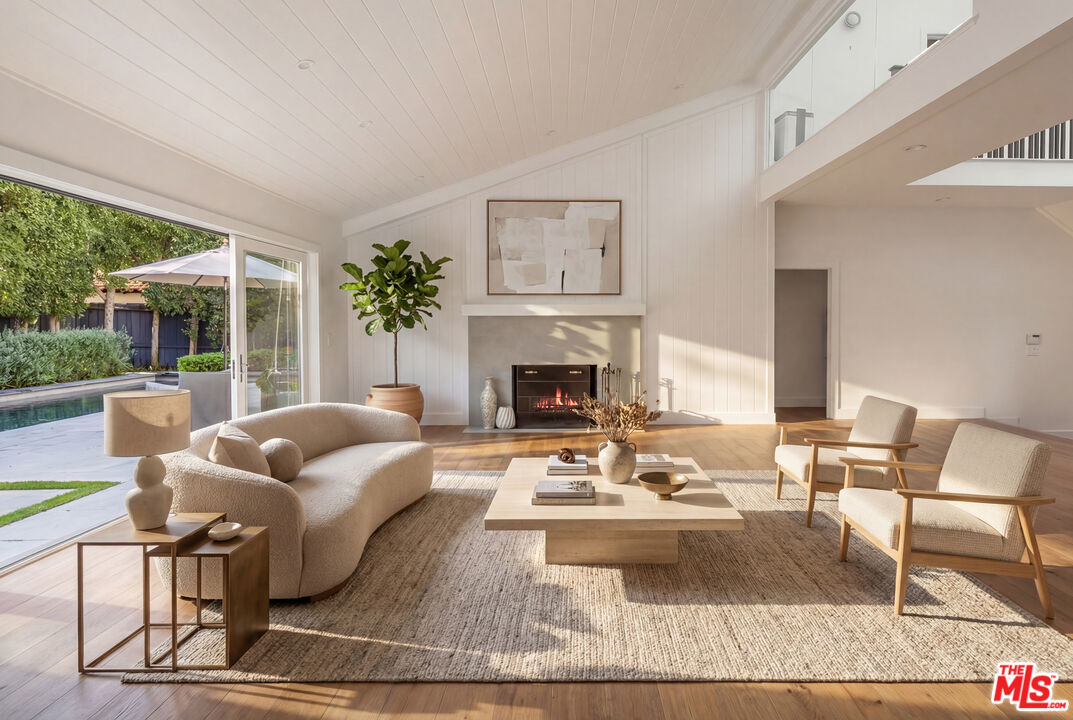 576 East Channel Road Santa Monica, CA 90402 - Photo 6 of 22 a living room with furniture and a fireplace