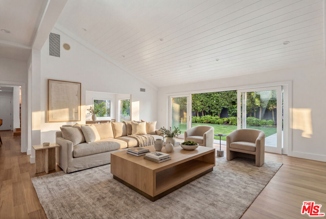 576 East Channel Road Santa Monica, CA 90402 - Photo 7 of 22 a living room with furniture and a large window