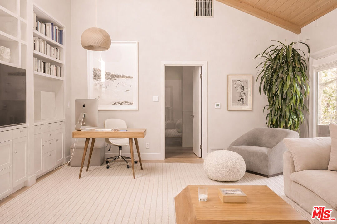 576 East Channel Road Santa Monica, CA 90402 - Photo 9 of 22 a living room with furniture and a rug